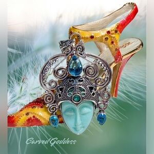 Silver and Blue carved Goddess Pendant with genuine topaz